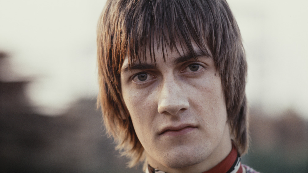 Young Mick Fleetwood staring into camera