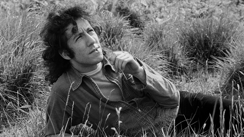 Peter Green laying in grass