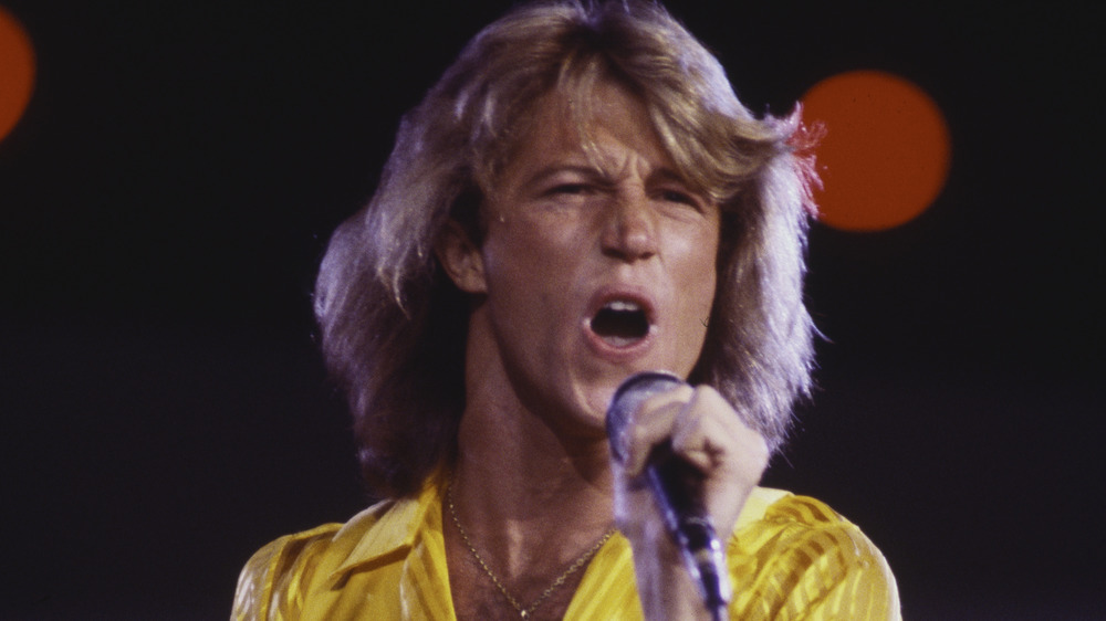 Andy Gibb singing in concert