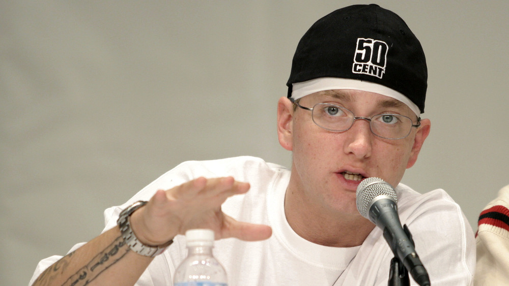 Eminem speaking into microphone 