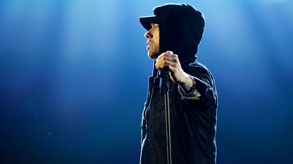 Eminem with hand on microphone