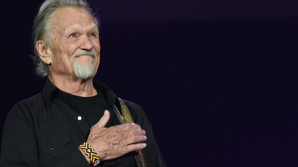 Kris Kristofferson with his hand on his heart