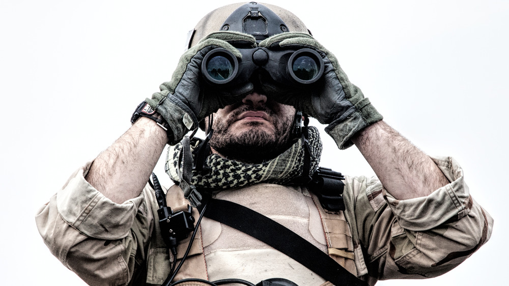 Navy SEAL on assignment, Navy SEAL using binoculars