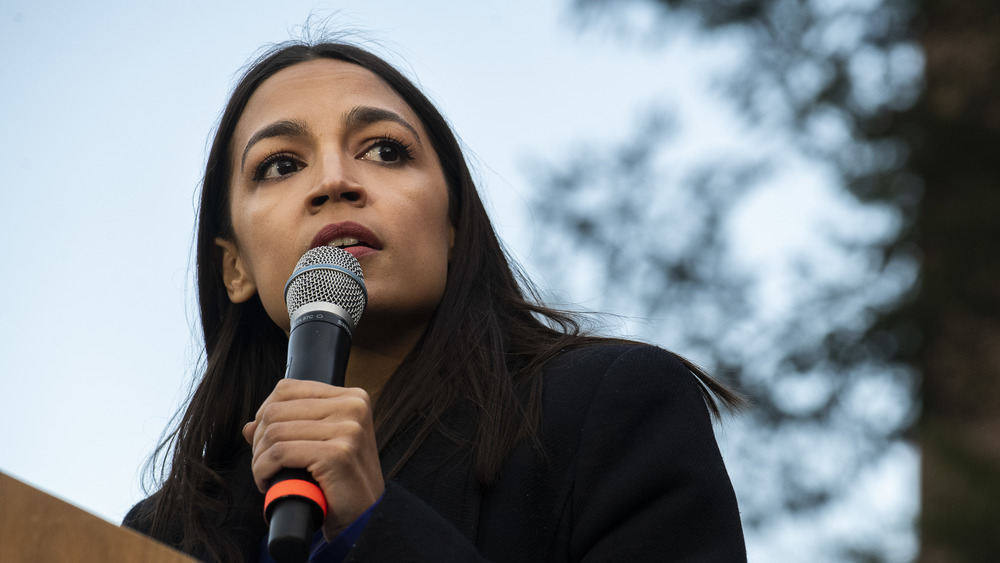 alexandria ocasio-cortez holding microphone 