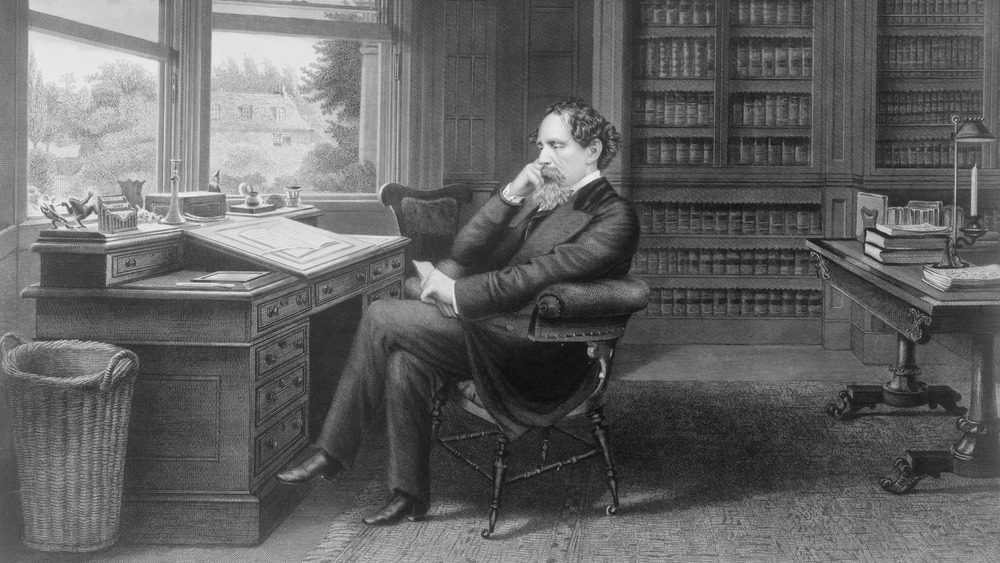 charles dickens sitting in his study