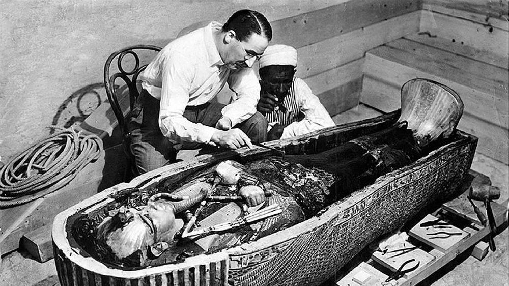 Howard Carter opens the innermost shrine of King Tut