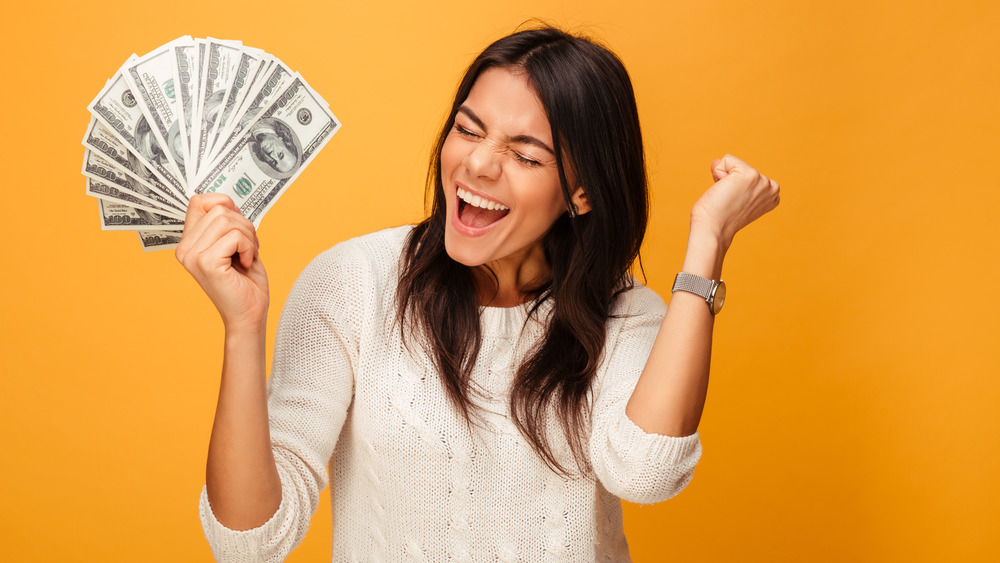 Woman celebrating winning money