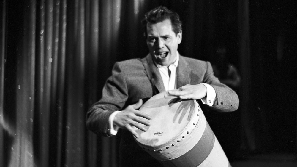 Desi Arnaz playing bongo drum