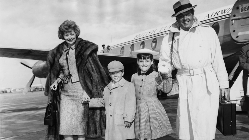 Lucille Ball Desi Arnaz with children getting off of plane