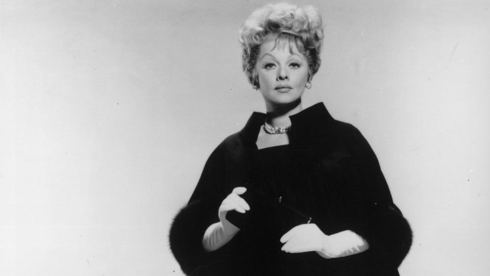  Lucille Ball wearing black coat and white gloves