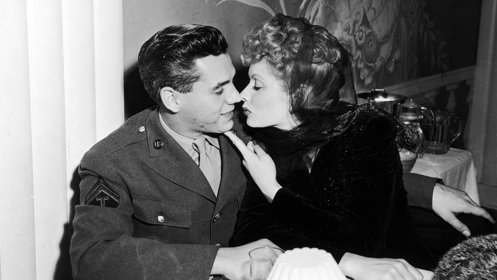 Lucille Ball and Desi Arnaz nearly kissing 