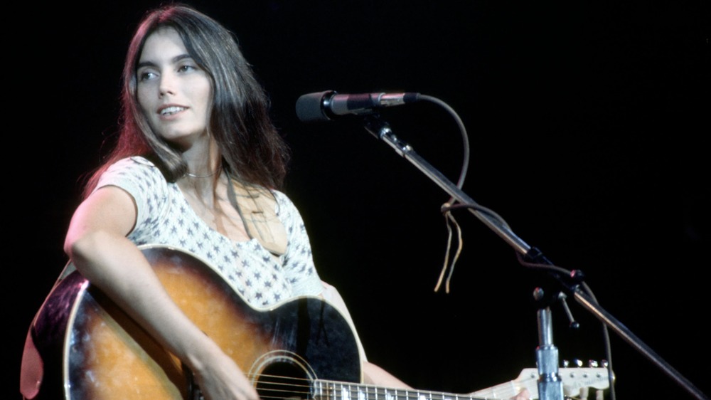 young Emmylou Harris performing onstage