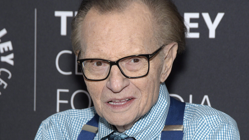 Larry King with trademark suspenders