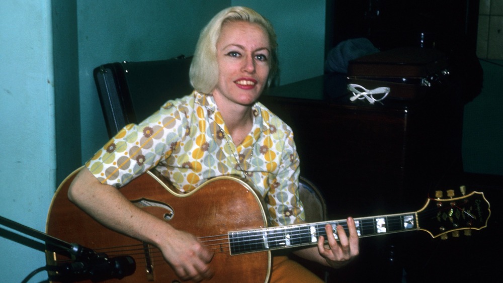 Kaye playing guitar, 1966