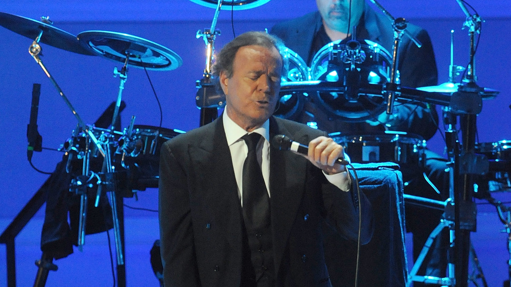 Julio Iglesias singing at mic