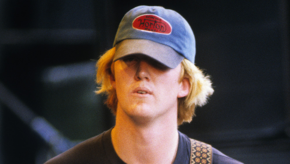 Josh Homme wearing baseball cap