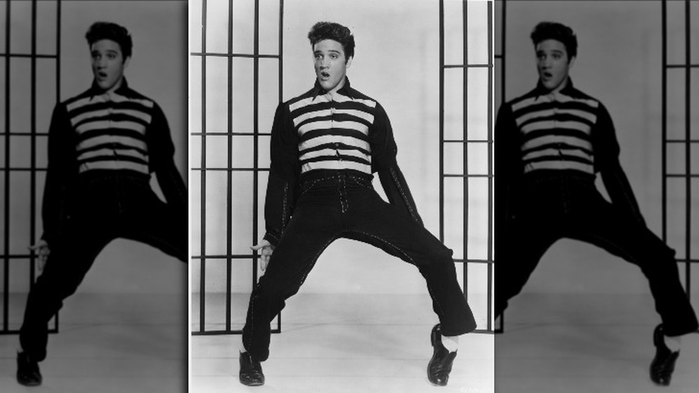 Elvis on his toes, thrusting his pelvis 