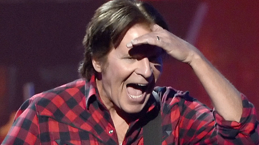John Fogerty with hand on forehead 