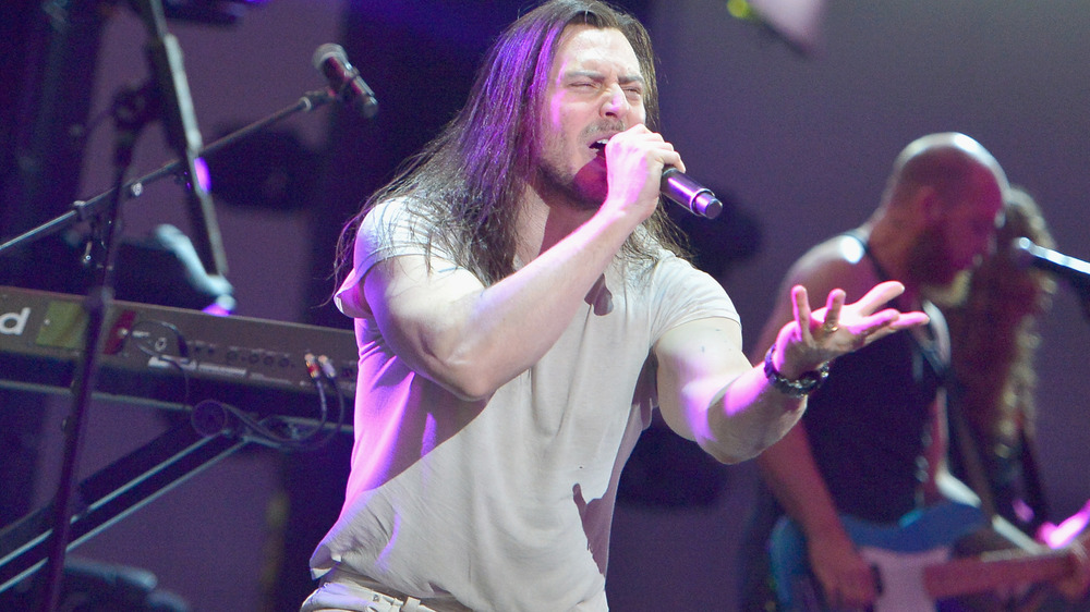 Andrew W.K. performing in white clothes