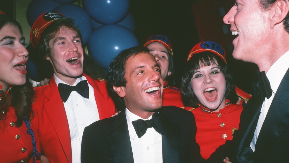 Steve Rubell laughing with others 