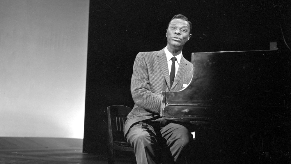 Nat King Cole playing the piano and singing