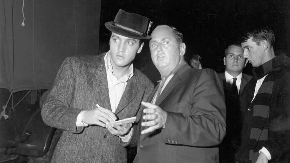 Elvis Presley and Colonel Tom Parker in 1957