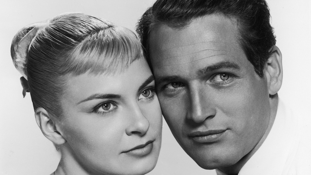 Paul Newman cheek to cheek with Joanne Woodward