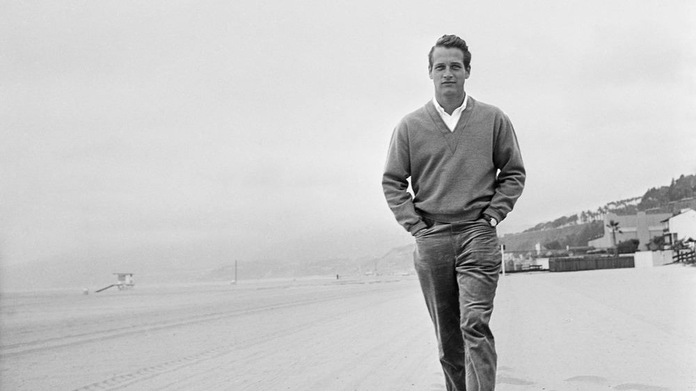 Paul Newman walking on the beach