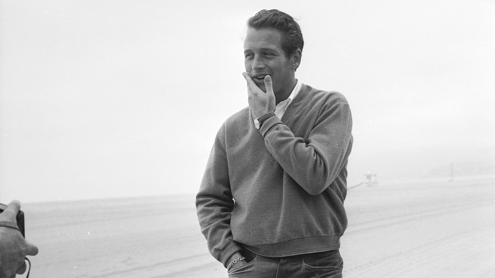 Paul Newman with hand on face