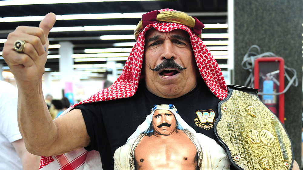 The Iron Sheik with a championship belt