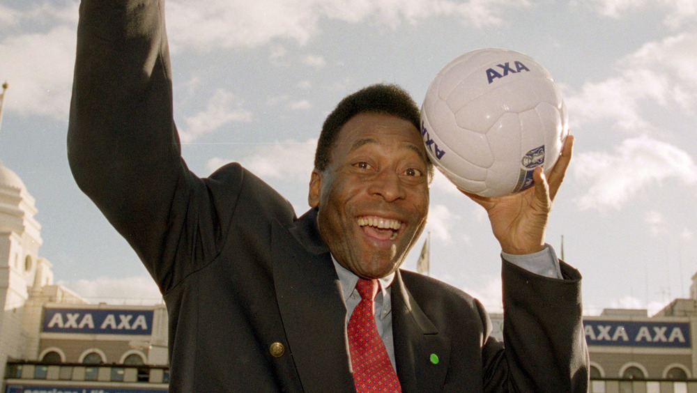 Pelé with soccer ball by head