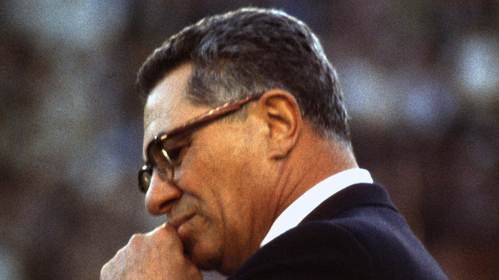 Vince Lombardi with hand on mouth