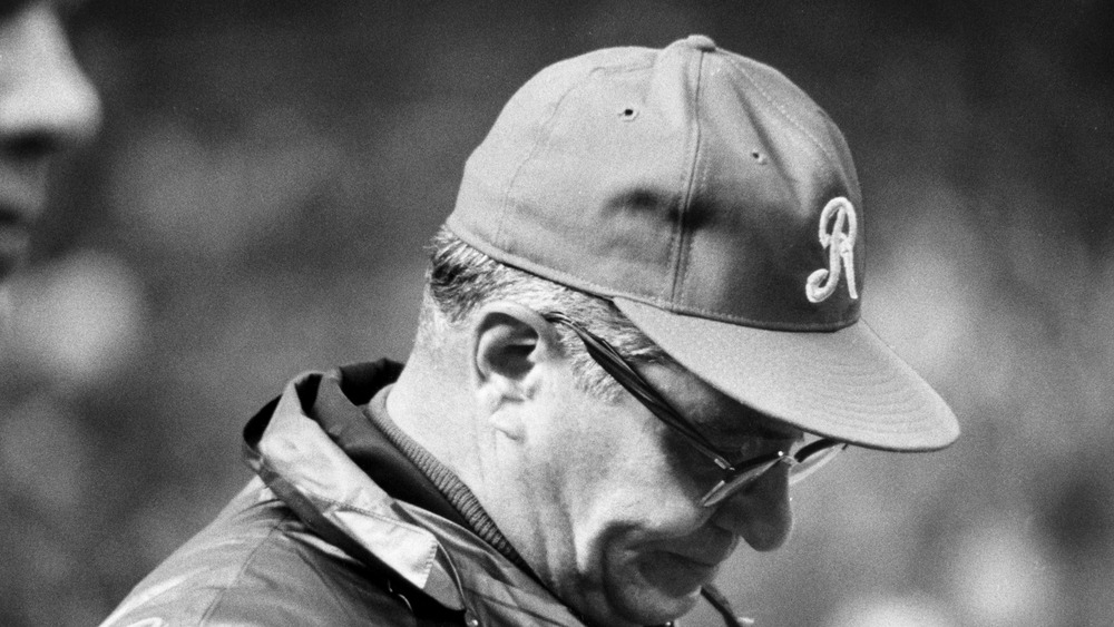 Vince Lombardi wearing baseball cap