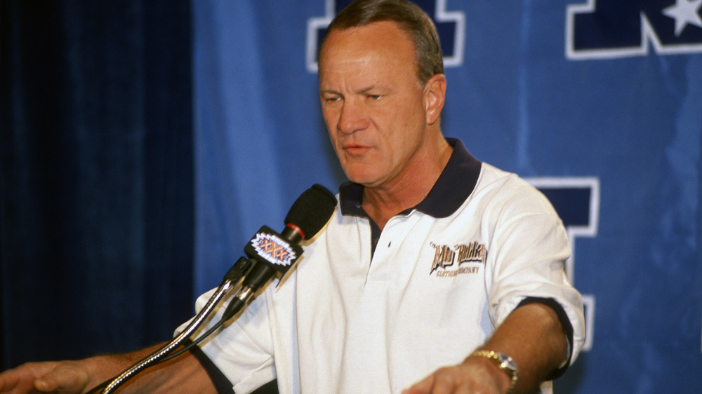 Barry Switzer speaking into microphone