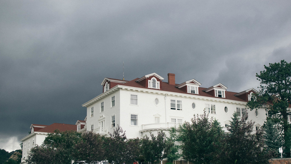 Exterior of Stanley Hotel with gray clouds