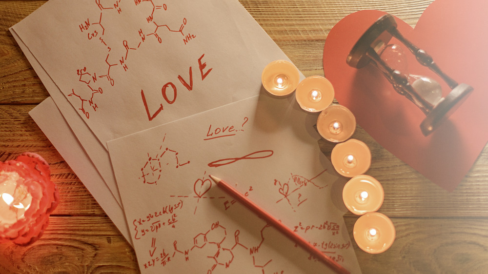 papers with love spell and chemical formulas