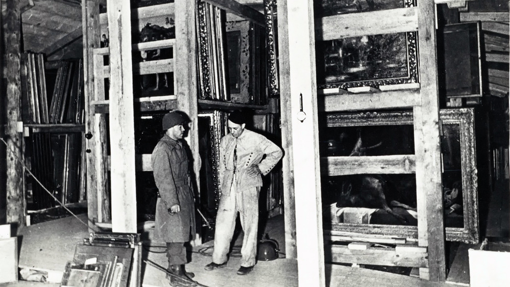 men standing among empty frames