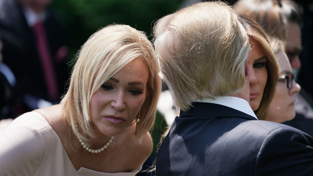 Paula White talking to Donald J. Trump.