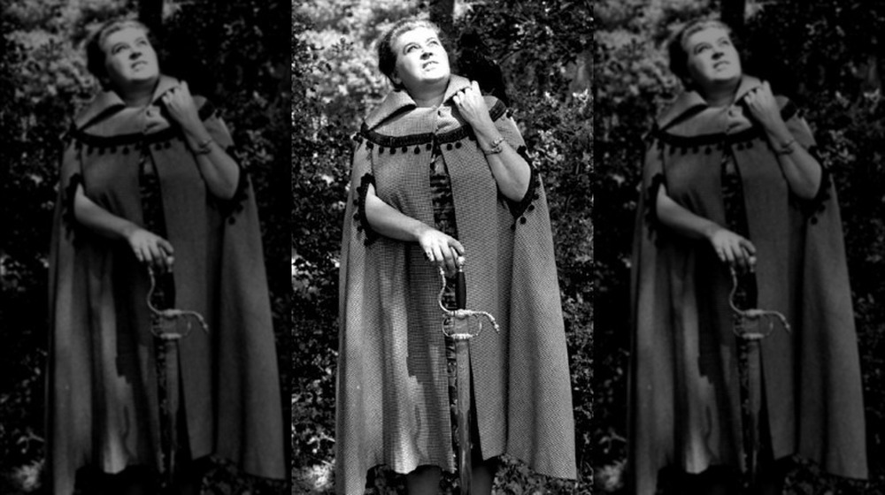 Sybil Leek standing in forest