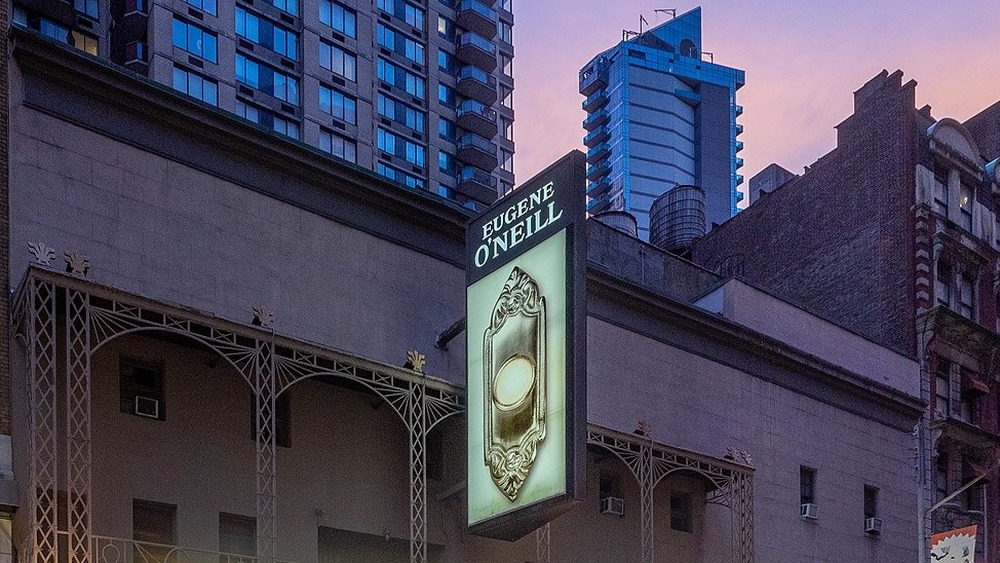 Eugene O'Neill Theatre on Broadway with sign for The Book of Mormon