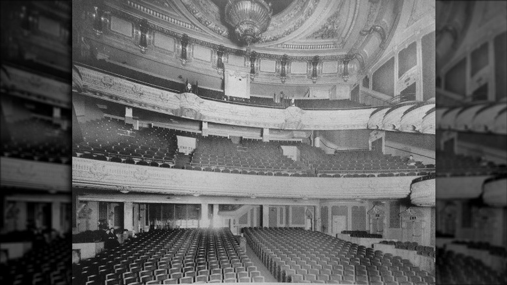 Interior of the Palace Theatre, with rows of seats 