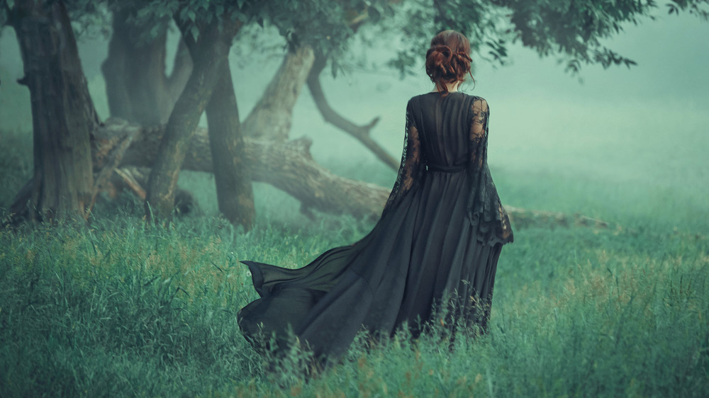 Mysterious woman in old-fashioned dress