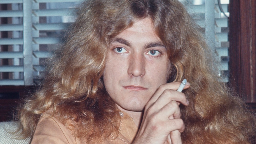 Robert Plant of Led Zeppelin smoking