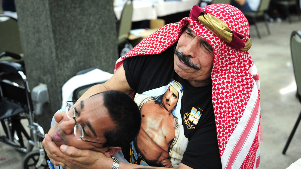 The Iron Sheik wrestling a fan