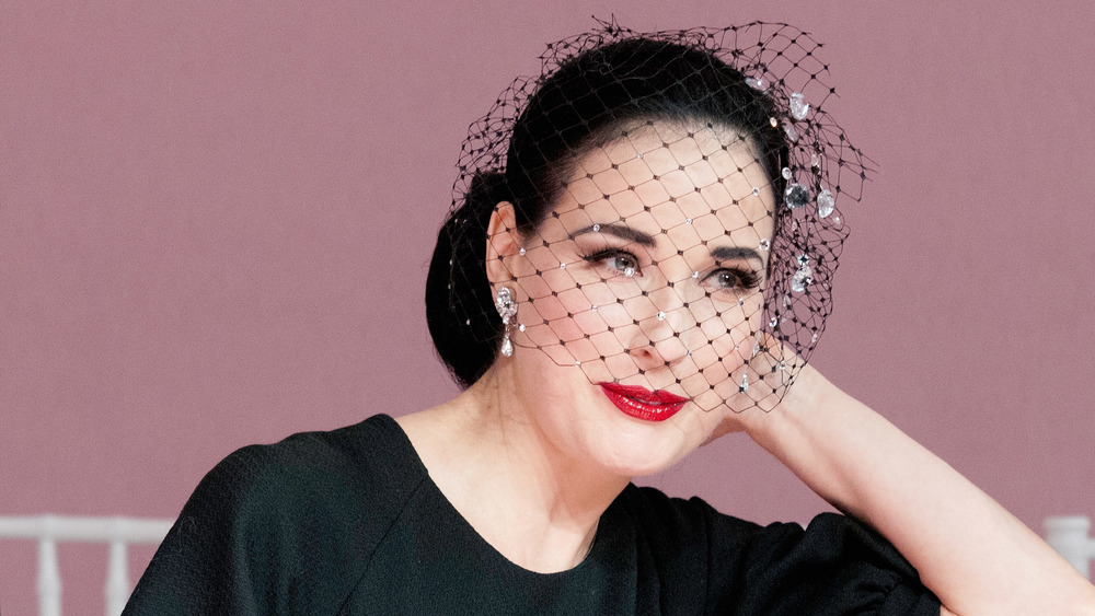 Dita Von Teese wearing a French net face veil