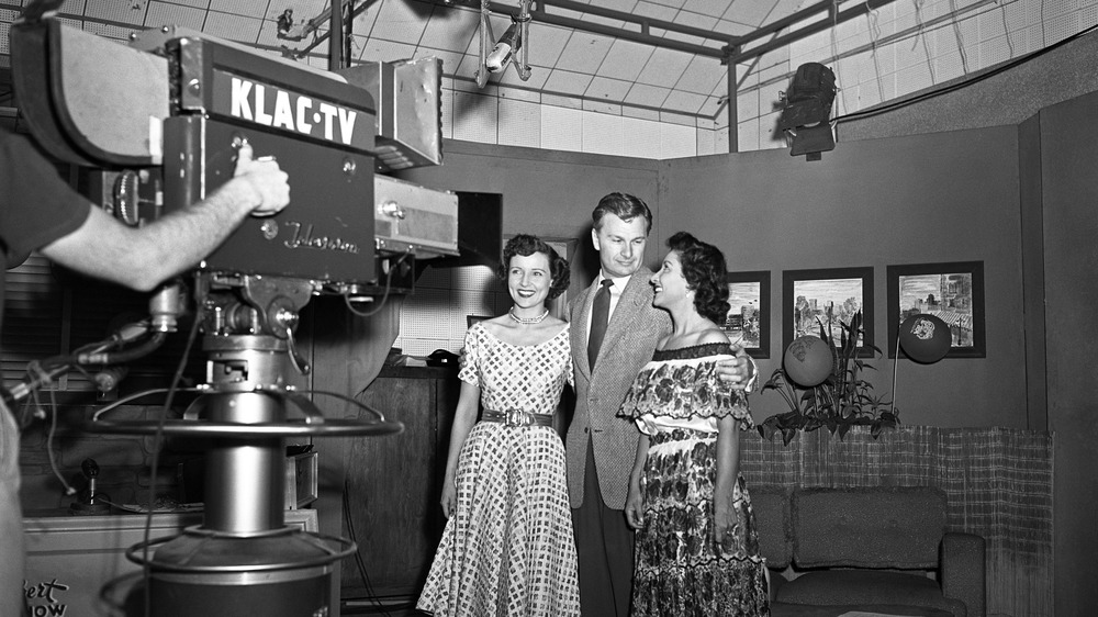 Betty White with Eddie Albert behind a tv camera