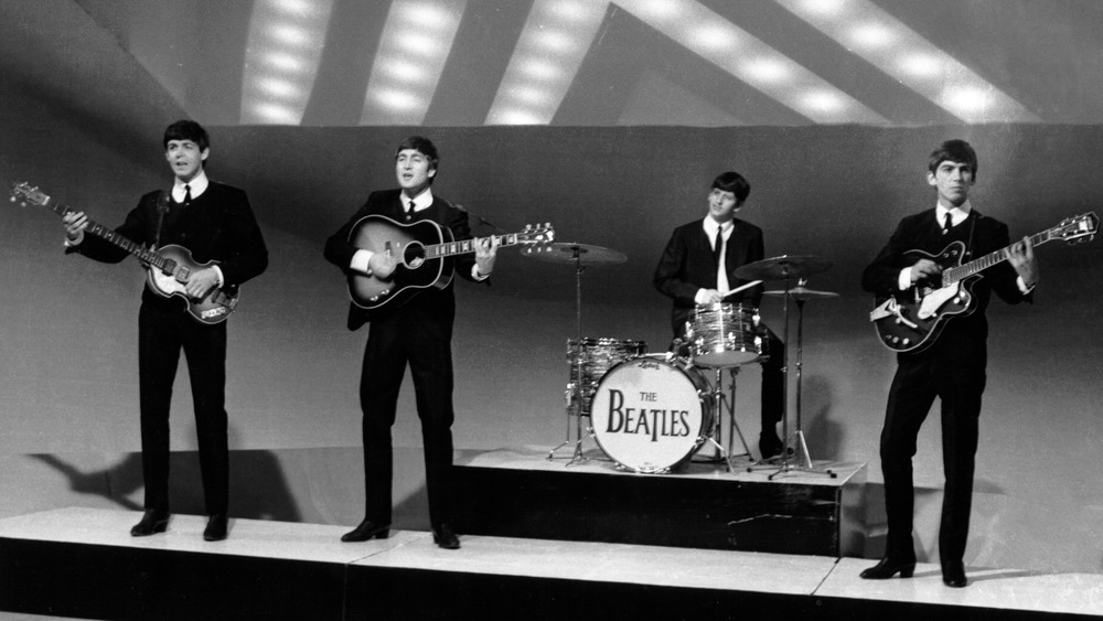 The Beatles performing in studio