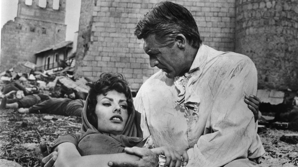 Cary Grant holding Sophia Loren on a film set