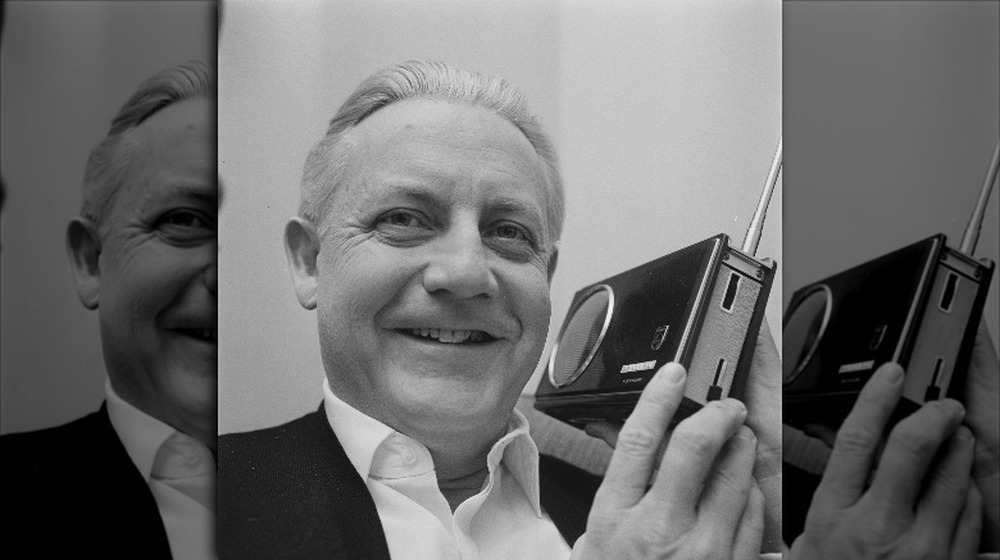 Director Robert Wise holds a camera