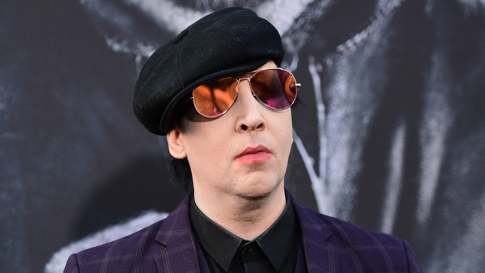 Marilyn Manson wearing a hat